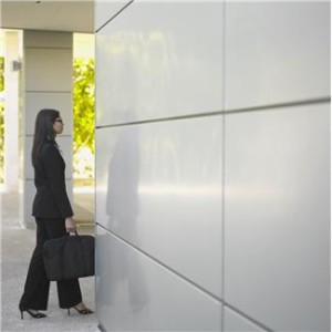 Woman-suit-by-elevator-300x300